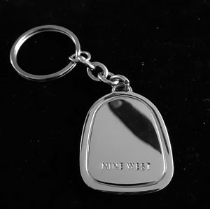 Nine West silver tag.